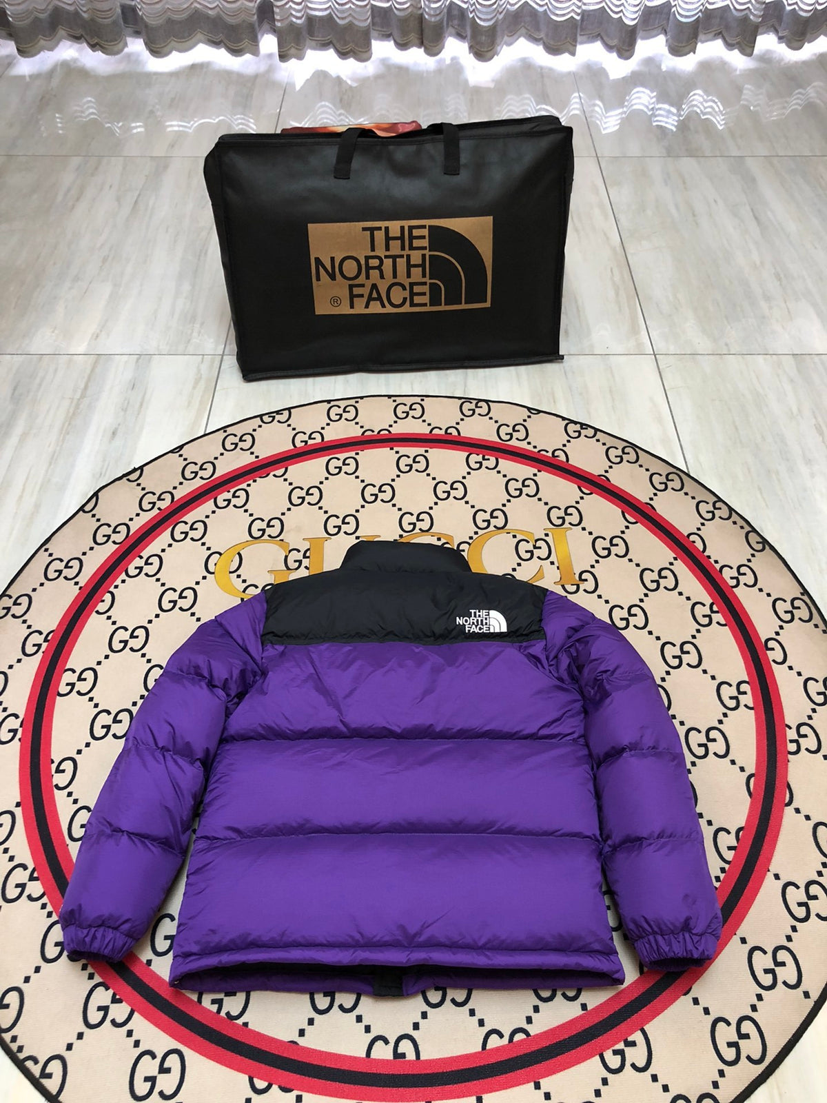 The North Face Purple and Black Stand-Collar Puffer Jacket