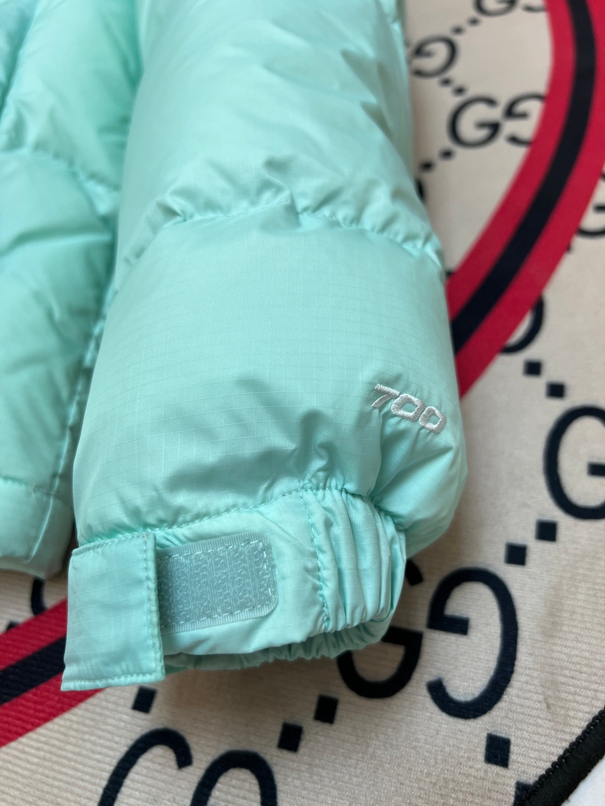 The North Face Mint Green and Black Color-Block Puffer Jacket