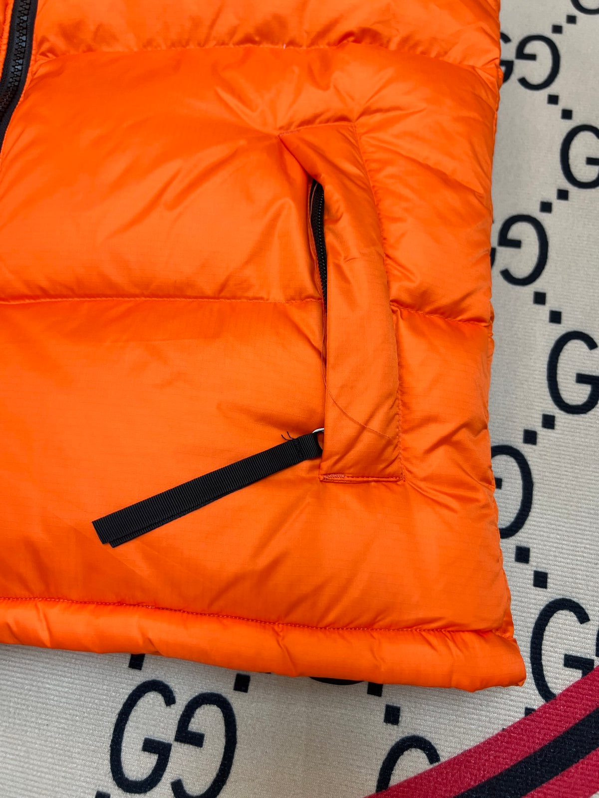 The North Face Orange and Black Colorblock Puffer Vest